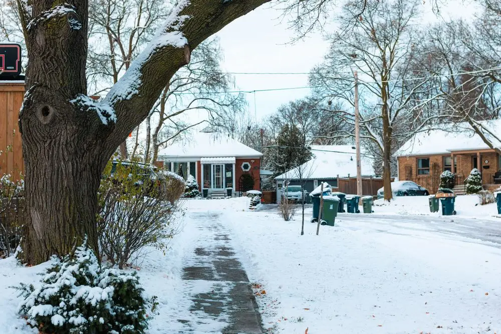Snow-covered residential street in winter